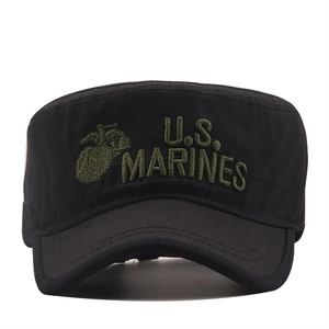 Close-up of US Marines logo embroidery on a black cotton military patrol cap