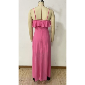 Detailed back view of pink evening dress featuring ruffled layers and a hidden zipper