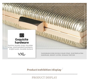 Macro detail of gold pleated clutch bag featuring metallic texture and snap clasp