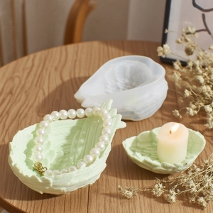 Leaf-shaped silicone mold and green resin jewelry tray with detailed vein textures