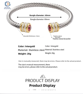 Detail view of two-tone stainless steel cable bracelet showing 60mm diameter and 5mm thickness