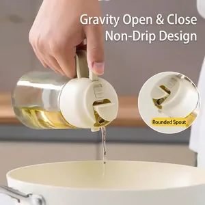 Gravity-flip glass oil dispenser bottle with leak-proof stainless steel spout for kitchen