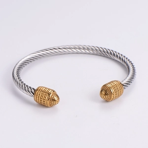 Twisted stainless steel cable bangle with silver and gold two-tone finish and bead ends