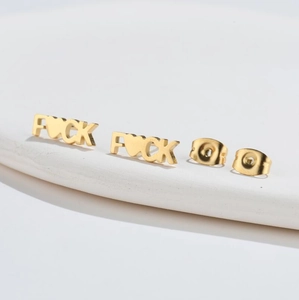 Minimalist gold-plated stud earrings featuring bold FUCK letter design with butterfly back