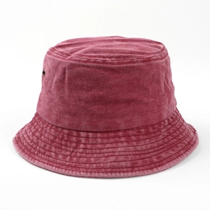 Detailed texture of burgundy washed cotton bucket hat with breathable metal eyelets