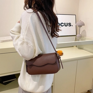 Chic brown leather crossbody square bag with flap design and adjustable strap for women