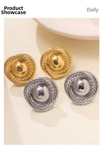 Detailed macro view of 18k gold and silver stainless steel earrings with rope texture