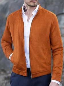 Detail of caramel brown suede jacket featuring a high collar and metal zip closure
