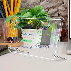 Macro shot of a clear acrylic weekly planner with To-Do lists on a desk