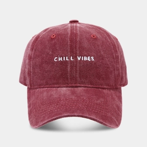 Detail of CHILL VIBES embroidery on burgundy washed cotton vintage baseball cap