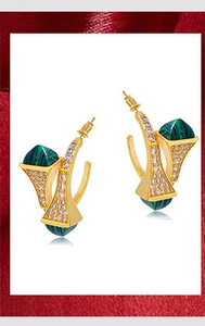 Macro shot of gold fan earrings featuring inlaid malachite and pavé zircon stones