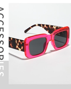 Detail of square pink translucent frame with leopard print arms and UV400 CE marking