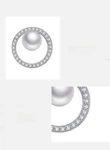 Detail of s925 silver stud earring with pavé zircon stones and a lustrous white pearl