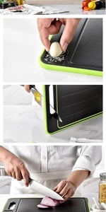 Detail of multi-functional black cutting board with built-in sharpener and garlic grinder