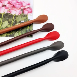 Detail of DIY leather handbag straps in five colors with pre-punched sewing holes