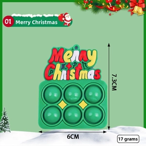 Detailed view of Merry Christmas silicone pop it keychain with 7.3cm by 6cm dimensions