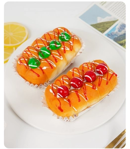 Macro view of realistic PU squishy cupcakes with fruit berries and cream drizzle
