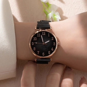 Elegant women's quartz watch with black leaf pattern dial and magnetic mesh strap