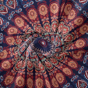 Macro view of spiral twisted bohemian tapestry fabric with colorful mandala patterns