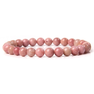 Macro shot of 6mm pink natural stone crystal beads showing authentic texture on a stretch bracelet