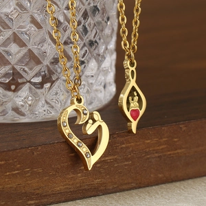 Detail of 18K gold-plated necklaces with hollow heart and red heart teardrop pendants
