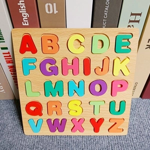 Macro view of wooden alphabet puzzle board with colorful A-Z 3D capital letters
