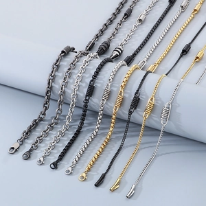 Detail of assorted spring-style titanium steel necklaces with lobster clasps in multi-colors