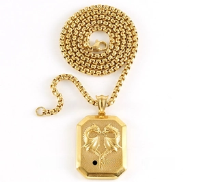 Close-up of 18K gold stainless steel pendant with 3D embossed dragons on a box chain