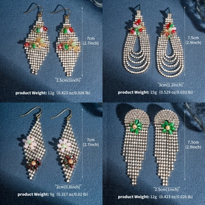 Detailed view of long tassel earrings with colorful rhinestones and floral zircon accents