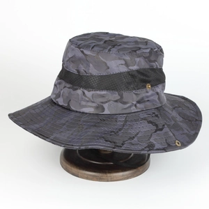 Detail of gray camo sun hat showing breathable mesh band and adjustable windproof strap