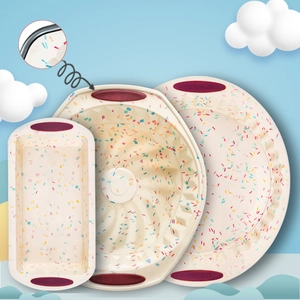 Silicone baking mold set detail, non-stick loaf pan and bundt cake pan with colorful sprinkle design.