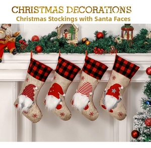 Set of 4 Christmas gnome stockings with red plaid cuffs hanging on a fireplace