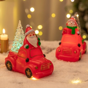 Vintage red car Christmas ornament with glowing tree, Santa and Snowman figures