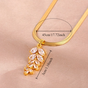 Gold leaf zircon pendant on sleek snake chain necklace with dimension markings