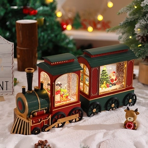 Macro shot of Santa locomotive music box with swirling glitter and festive LED glow
