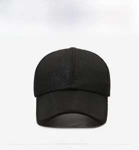 Detailed view of black breathable mesh baseball cap featuring a square mountain badge