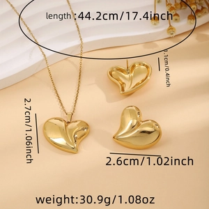 Detail showing dimensions of heart-shaped gold necklace and earrings jewelry set