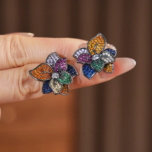 Detail of vintage flower stud earrings with vibrant multi-color zircon crystal petals