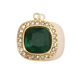 Macro detail of square green stone pendant with sparkling white rhinestones and gold frame