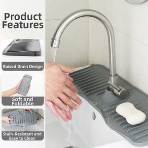 Close-up of gray silicone faucet mat with drainage ridges and flexible folding design