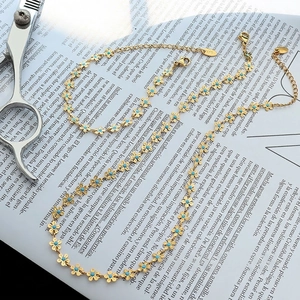 Elegant 18k gold plated necklace and bracelet set with light blue flower enamel charms