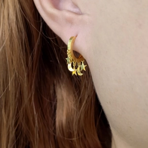 Close-up of S925 sterling silver gold-plated hoop earrings with star and moon charms