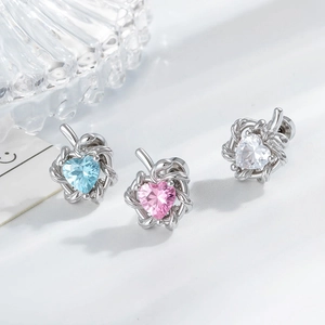 Snake heart stud earrings with cubic zirconia in light blue pink and white silver finish