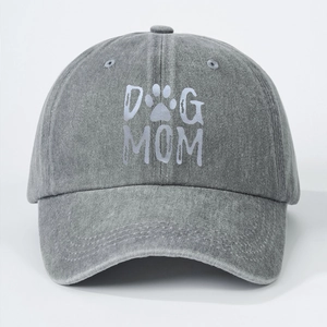 Detail of DOG MOM printed text and paw motif on washed denim grey baseball cap