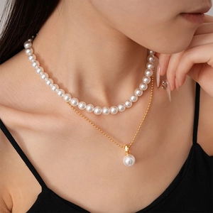 Elegant 2-piece layered pearl necklace set with gold plating for a vintage minimalist look