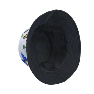 Close-up of white bucket hat featuring colorful butterfly prints and black inner brim