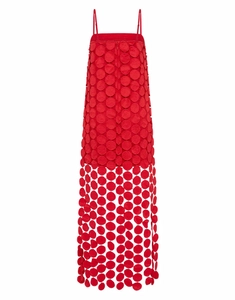 Detail of red hollowed-out polka dot dress with fringe and unique textured patches