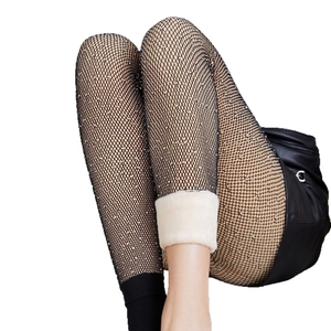 Fleece lined fishnet tights with rhinestones for winter warmth and sexy black mesh style