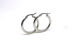 Macro view of 3mm thick silver stainless steel hoop earrings with spring closure
