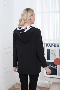 Rear view of a long black hooded jacket for women with stylish patterned hood lining